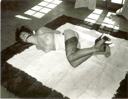 John Willie bondage photo in the Spanish Foyer setting