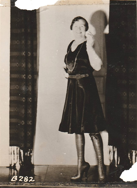 1930s photograph of woman wearing tall boots.